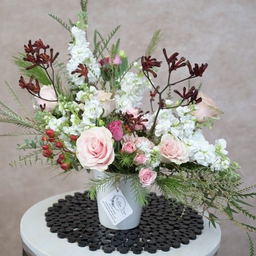 Floral arrangement design, blush garden roses with white anemones and soft greenery in a refined compositional arrangement by a Raleigh NC florist - floral arrangement design