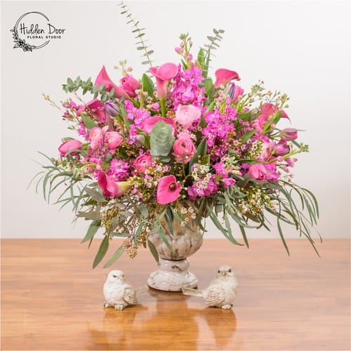 Flower Delivery Five Points - Soft pink roses on a natural wood surface hand delivered to the Five Points neighborhood in Raleigh NC