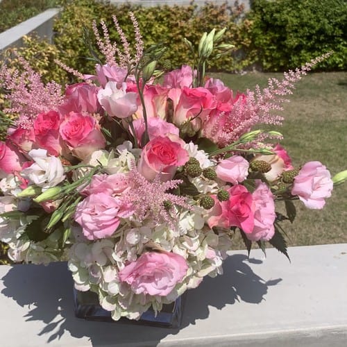 Purple and violet mixed arrangement with artistic flair for flower delivery in Durham NC