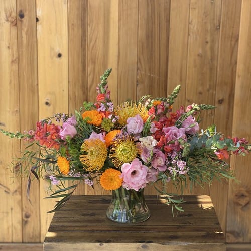 Flower Delivery Oberlin Village - Pink coral and peach mixed flowers in a clear glass vase for delivery to Oberlin Village in Raleigh