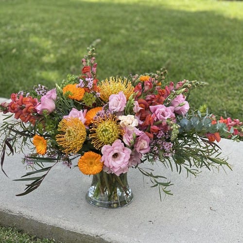 Flower Delivery in Downtown Raleigh 1 Flower Delivery Downtown Raleigh - Large vibrant garden arrangement with orange pink and coral blooms delivered to Downtown Raleigh NC