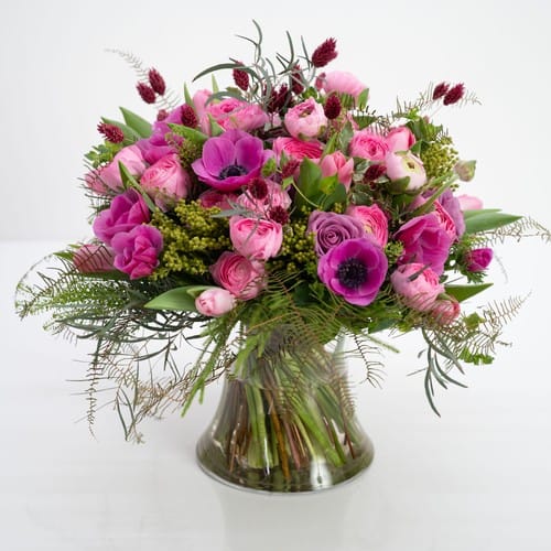 Soft pink and green garden arrangement with fresh-cut stems and lush foliage showing flowers at their freshest - keep cut flowers fresh