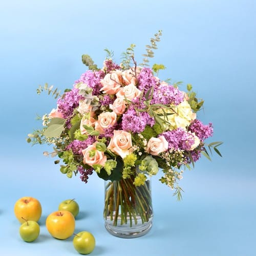 Peach and coral garden roses with soft trailing greenery for flower delivery to Amberly in Cary NC